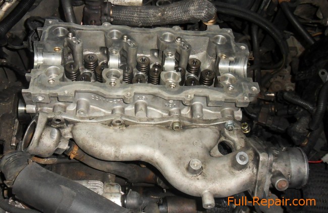 bolted to the cylinder head intake manifold